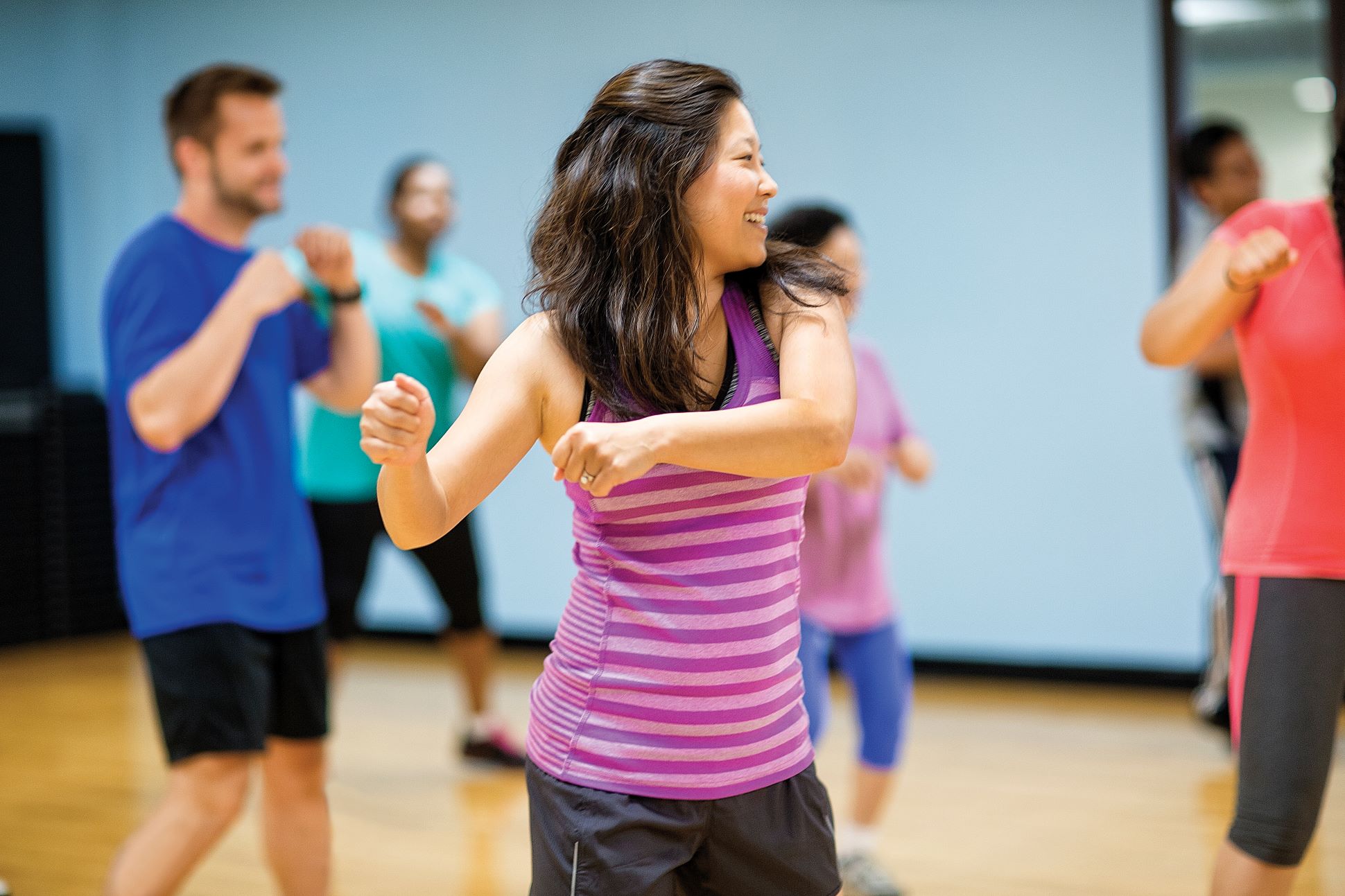 Adults exercising in a kickboxing class at the Kansas City YMCA.