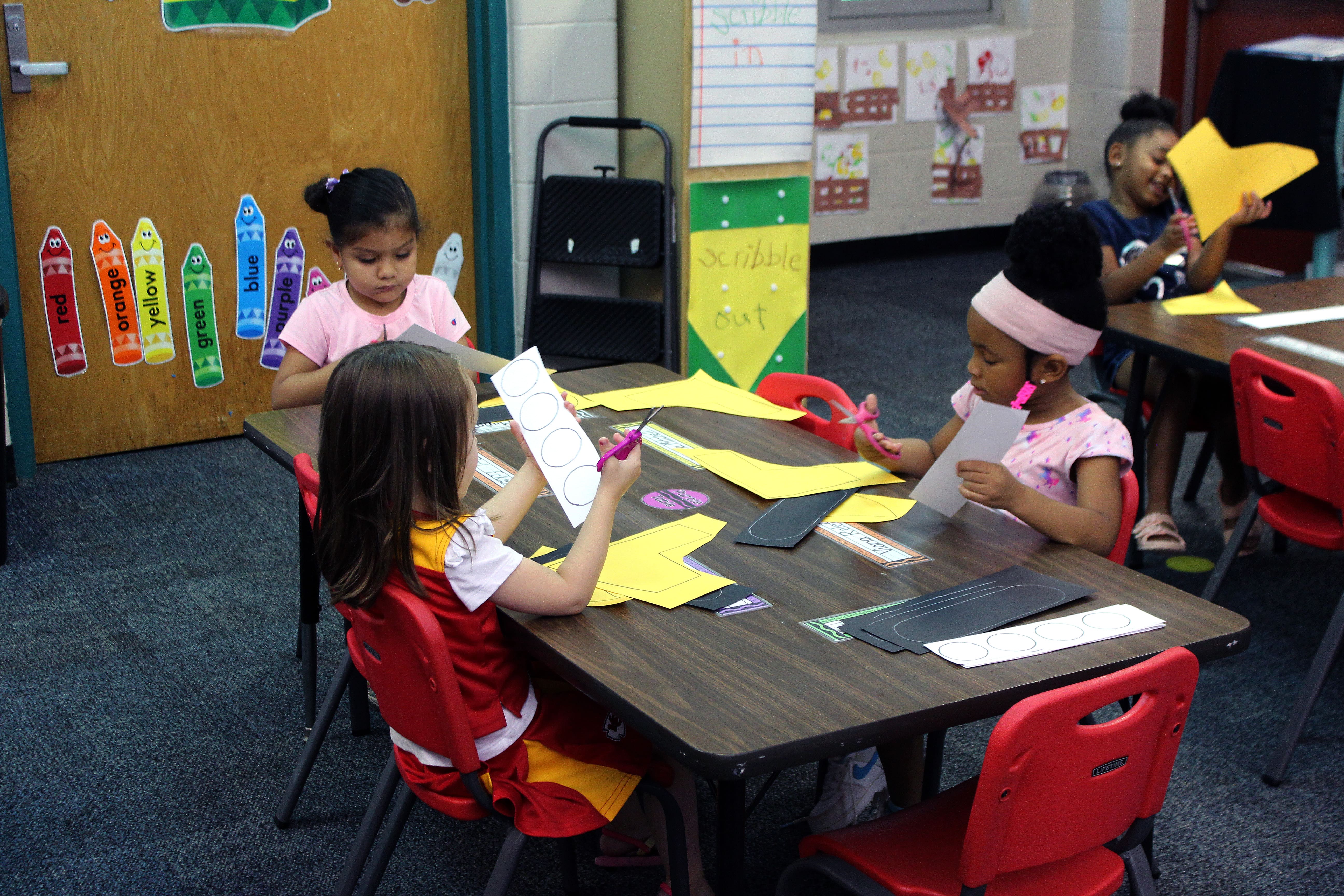children cutting circles