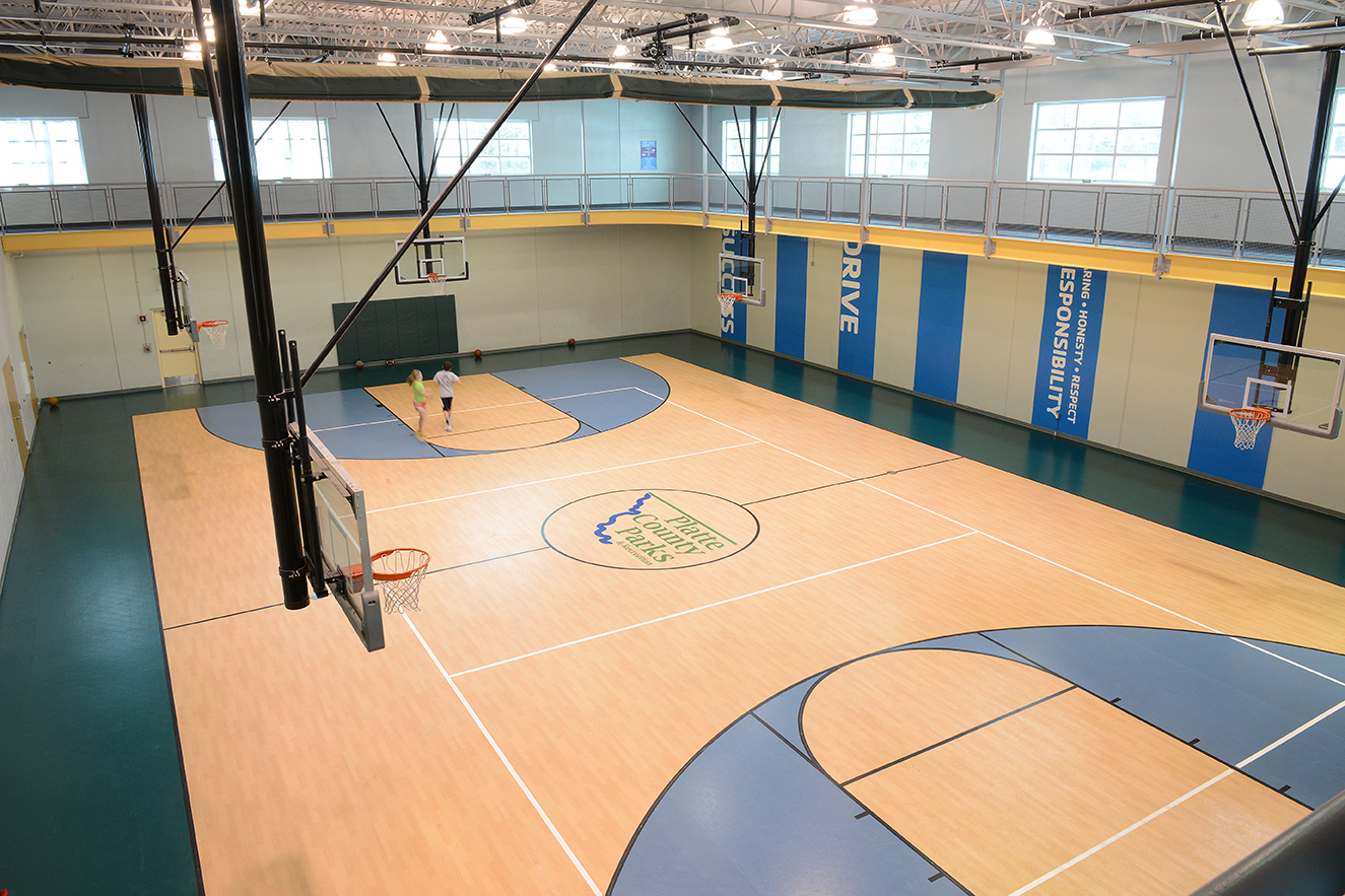 Photo looking down from the walking track into the gym to see the basketball court