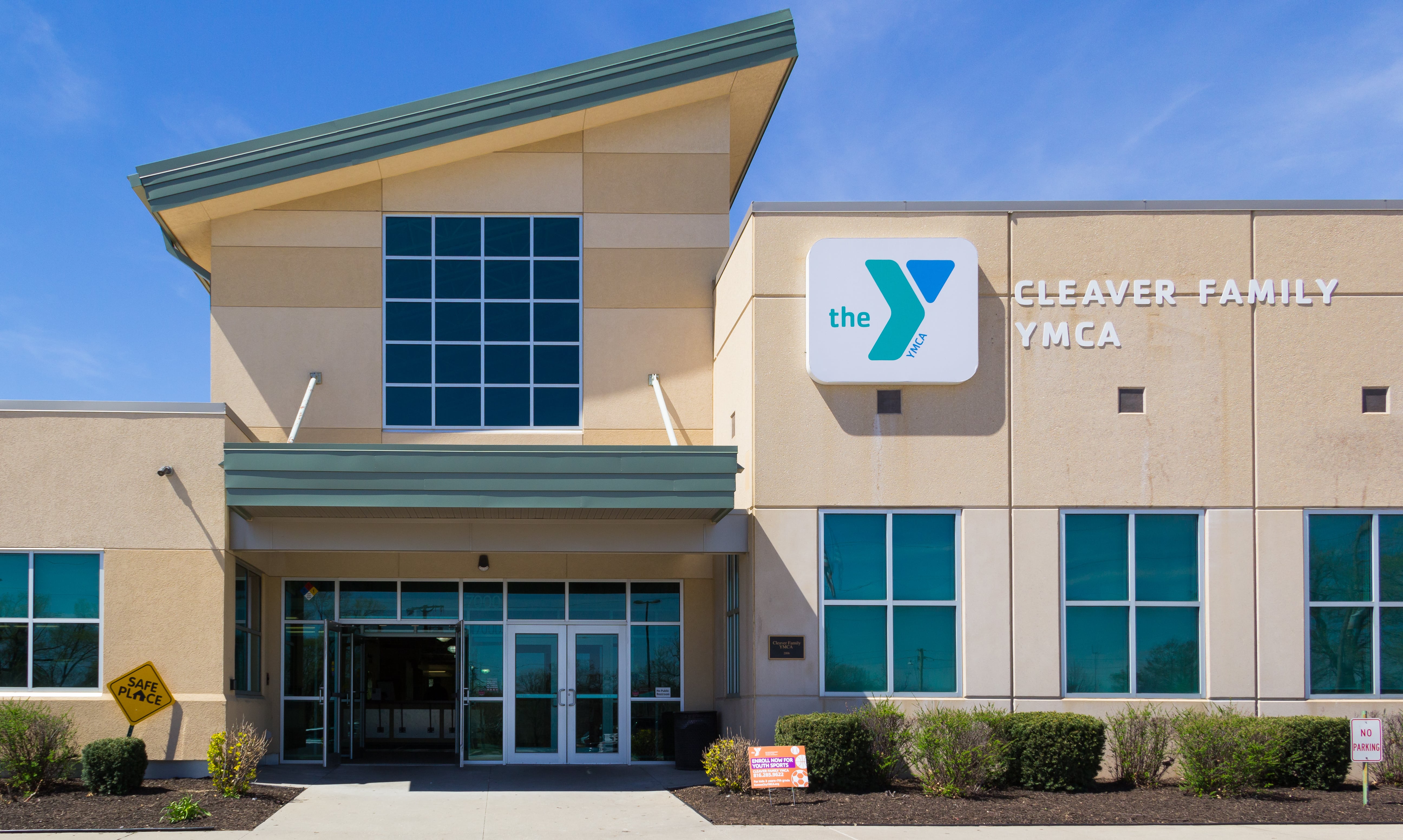 Exterior image of Cleaver Family YMCA, showing entrance and logo signage on the building