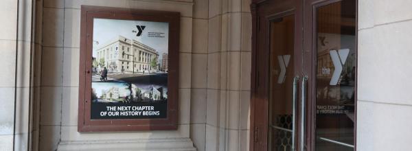 Renderings of the new Y decorated the entrance to the lobby of the historic building.